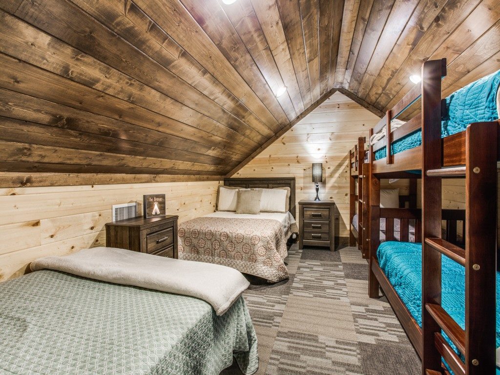 Charming bunk room with rustic wooden bunk beds