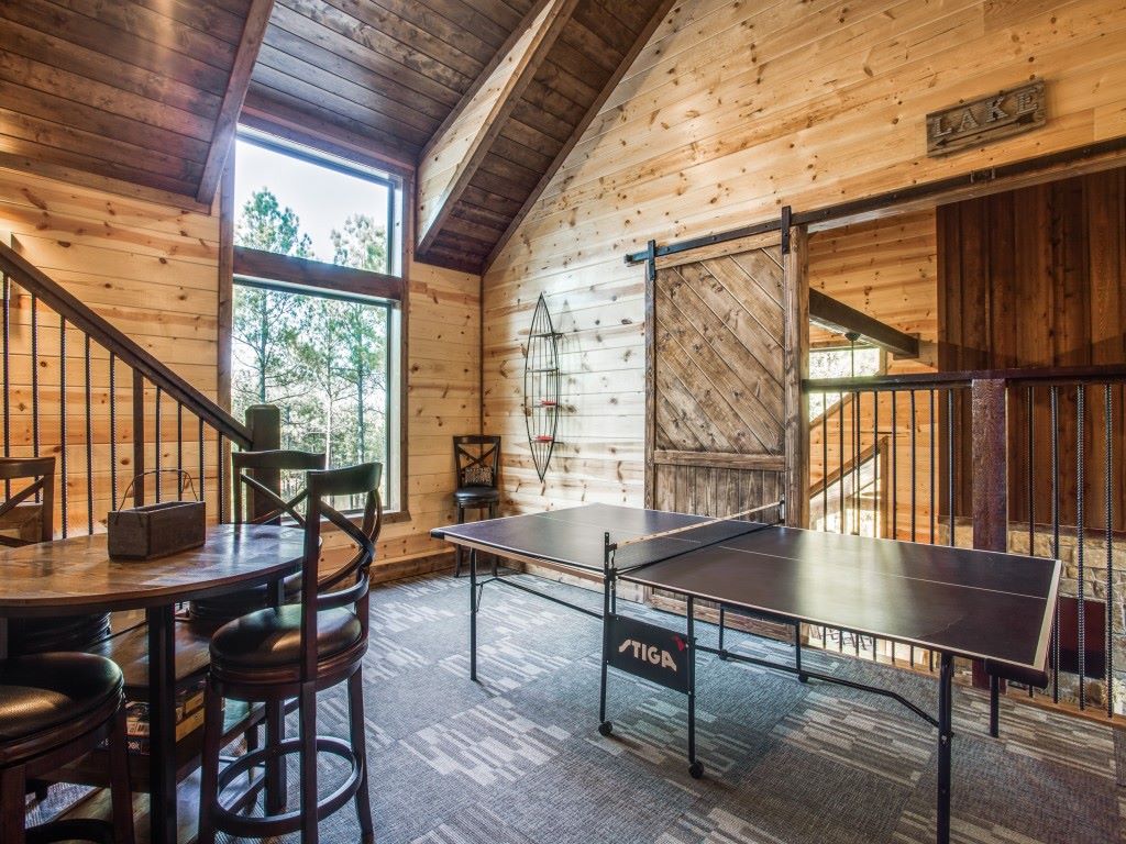 Guests can enjoy a lively game of ping pong in the cabin’s game room