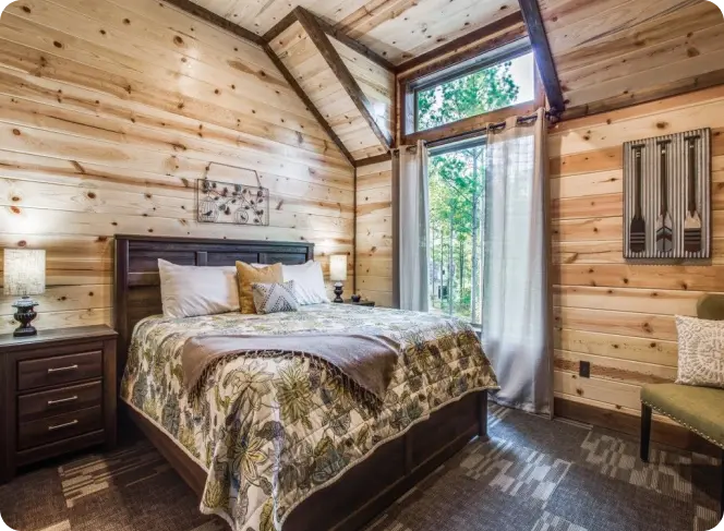 Comfortable bedding and serene decor in the cabin's bedrooms